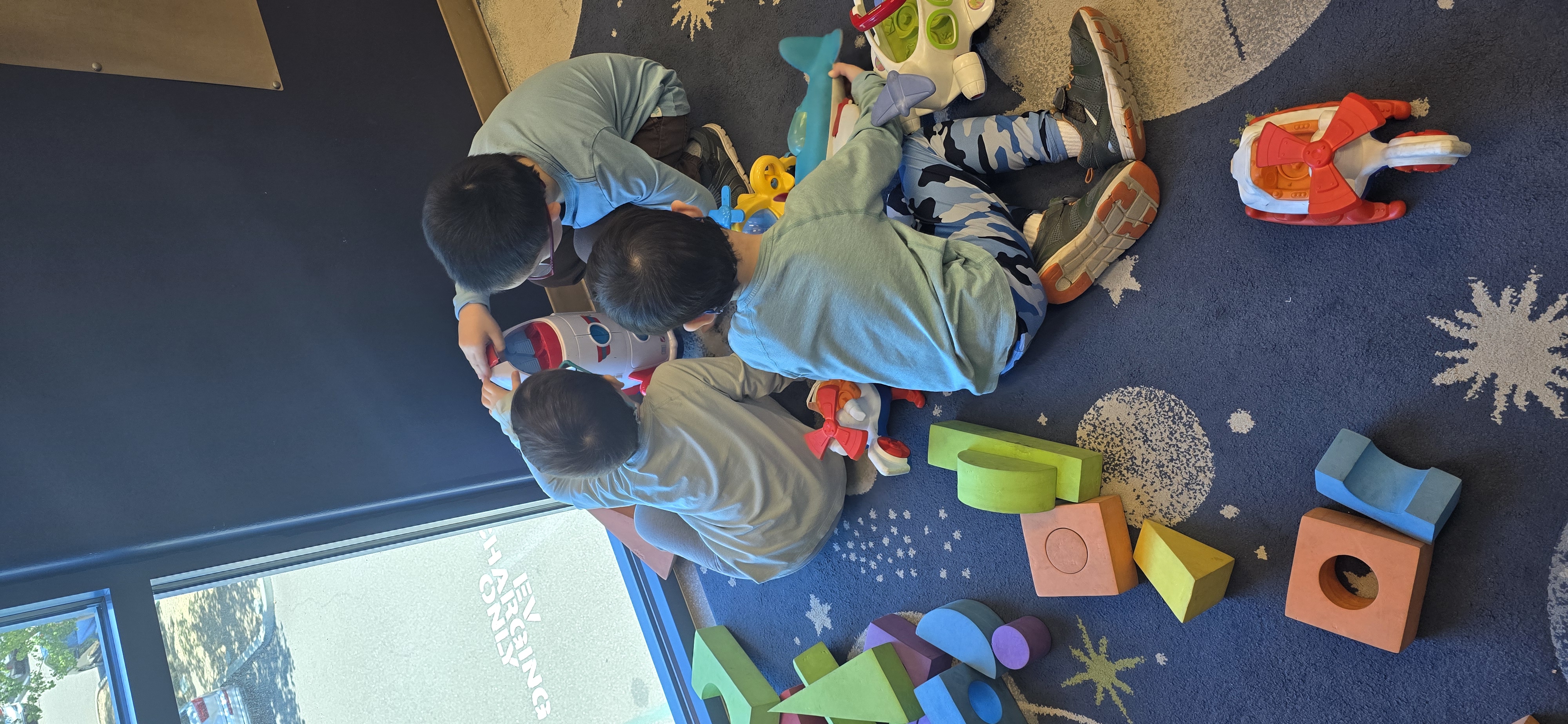 Children assembling toys during Moon Day at the Aerospace Museum of California